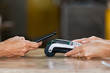 © Rido - Paying with contactless smartphone