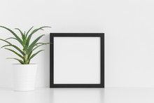 Black Square Frame Mockup With A Aloe Vera In A Pot On A White Table.