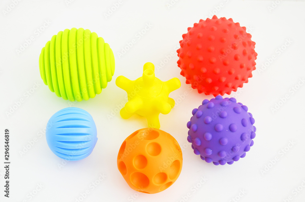 tactile or sensory balls to enhance the cognitive and physical processes of children - obrazy, fototapety, plakaty 