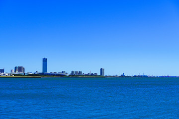 Wall Mural - Landscape of Makuhari city in the background of blue sky in Chiba Japan