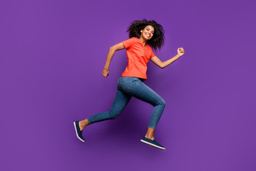 Wall Mural - Full length body size photo of side profile curly wavy cheerful nice pretty youngster running forward to shopping mall before holidays isolated over vivid color violet background