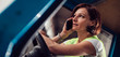 © kerkezz - Woman forklift operator talking on the phone in vehicle