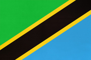 Wall Mural - Republic Tanzania national fabric flag textile background. Symbol of world african country.