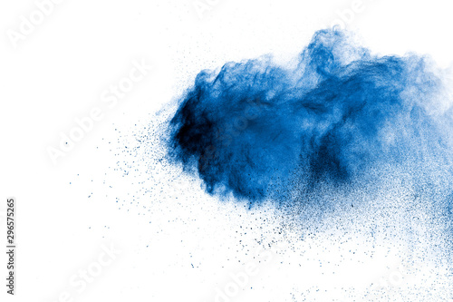 Blue color powder explosion cloud on white background.Closeup of Blue dust pa...