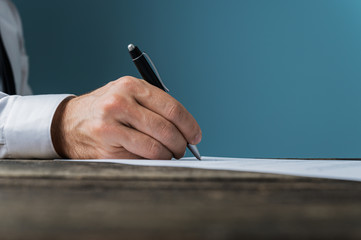 Wall Mural - Businessman or lawyer signing a document