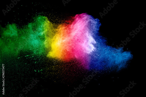 Colorful background of pastel powder explosion.Rainbow color dust splash on b...