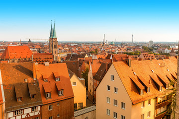 Wall Mural - Aerial sunset scenic view of red roofs in Nuremberg city, Germany. Summer sunset in old town