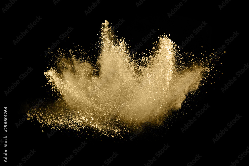 Golden powder explosion on black background. Freeze motion. - obrazy, fototapety, plakaty 