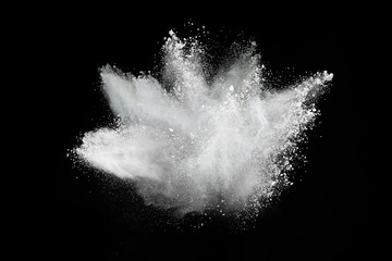 Wall Mural - white powder explosion on black background. colored cloud. colorful dust explode. paint holi.