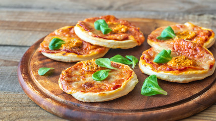 Wall Mural - Mini pizzas on the wooden board