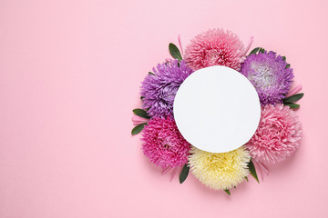 Canvas Print - Flat lay composition with beautiful aster flowers and blank card on pink background. Space for text