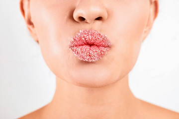 Poster - Young woman with sugar lips on white background, closeup