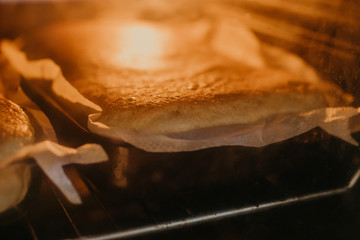 traditional homemade cake or sponge cake baking inside the oven