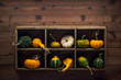 Colorful decorative gourds in a wood storage box mounted on dark wood planks wall