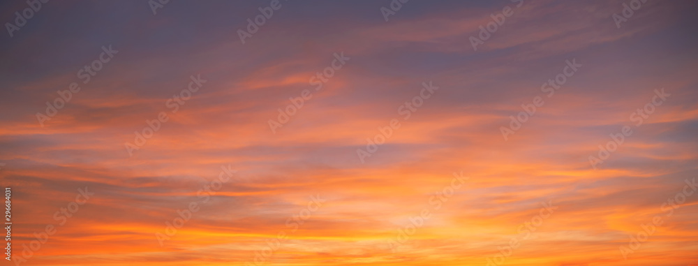 Sunset sky. Abstract nature background. Dramatic blue and orange, colorful clouds at twilight time. - obrazy, fototapety, plakaty 