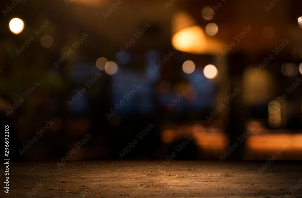 Empty wood table top on blur light gold bokeh of cafe restaurant in dark background - obrazy, fototapety, plakaty 