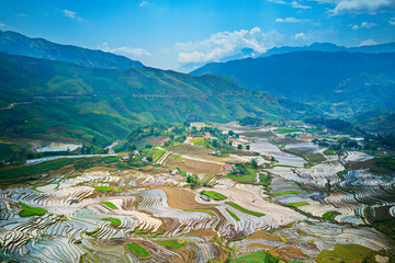 Aerial image of great rice terraces in Y Ty, Lao Cai, Vietnam in watering season (from May to June every year)