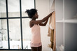 © zinkevych - Slim woman wearing pajamas standing near wardrobe