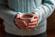 Woman with cup of tasty cocoa, closeup