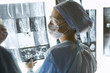 © lenetsnikolai - Two female women medical doctors looking at x-rays in a hospital