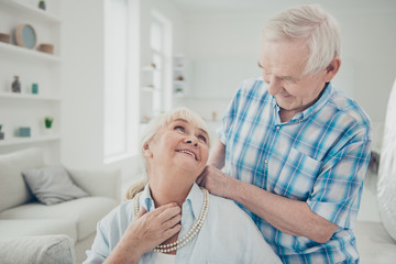 Wall Mural - Photo of two adorable aged people pair spending time together holiday surprise pearls necklace comfortable flat indoors