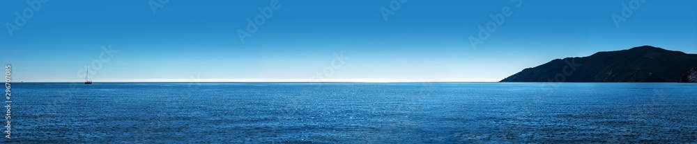 ocean panorama island and sailboat - obrazy, fototapety, plakaty 