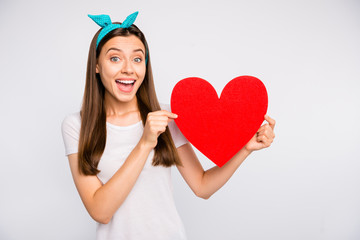 Wall Mural - Portrait of amazed excited girl hold red big paper card heart gift for 14-february celebration with her boyfriend scream wow omg wear lifestyle outfit isolated over white color background