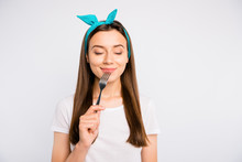 Portrait Of Inspired Dreamy Girl Hold Fork Feel Hungry Want Eat Imagine Tasty Meal Delicious Burger Close Eyes Wear Stylish Blue Headband T-shirt Isolated Over White Color Background