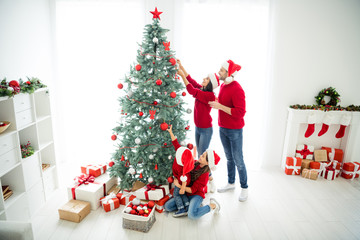 Wall Mural - Full length body size above high angle view of four nice cheerful dreamy big full foster affectionate family celebrating newyear enjoying leisure domestic tradition in light white interior room