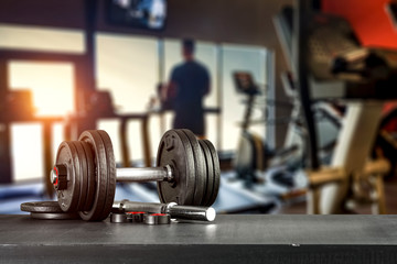 Gym interior and dumbbells. Free space for your decoration. 