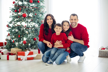 Wall Mural - Full size photo of big full family pretty mom dad schoolgirl hug sitting near gift box present for christmas time x-mas holidays in house indoors