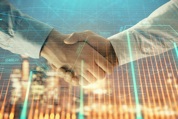 Double exposure of financial chart on cityscape background with two businessmen handshake. Concept of financial analysis and investment opportunities