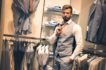 Businessman in a shop. Elegant, fashion.