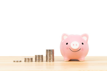 Poster - Piggy bank with coin stack on white background