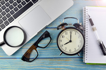 Flat lay business workplace and objects on wooden background. Selective focus.