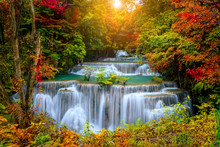 Colorful Majestic Waterfall In National Park Forest During Autumn - Image