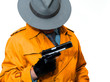 Classic private investigator holds a large loaded gun
