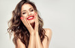canvas print picture - Beautiful laughing brunette model  girl  with long curly  hair . Smiling  woman hairstyle wavy curls . Red  lips and  nails manicure .    Fashion , beauty and make up portrait
