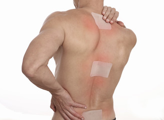 medicated pain relief patch, plaster. man with back pain. pain relief and health care concept isolat