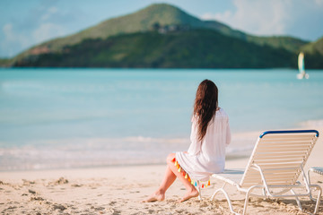 Wall Mural - Young fashion woman in swimsuit on the beach