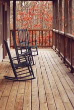 Rocking Chairs On Front Porch In Fall