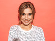 © halayalex - Young beautiful woman looking at camera. Trendy girl in casual summer shirt clothes with natural makeup. Positive female smiling. Funny model posing near pink wall in studio
