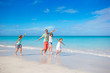 © travnikovstudio - Happy family on the beach during summer vacation