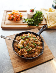 Wall Mural - pasta dish in a cast iron skillet at a restaurant