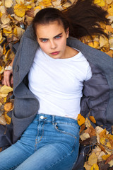 Top view portrait of a young beautiful woman in a white sweater