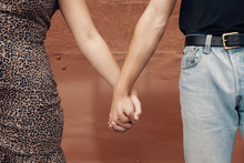 Close Up Of Two People Holding Hands