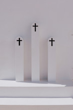 View Of Black Crosses On White Stone Columns
