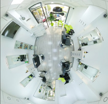 Little planet view panorama of modern bright hair and beauty salon. Fisheye lense distortion barber salon interior business