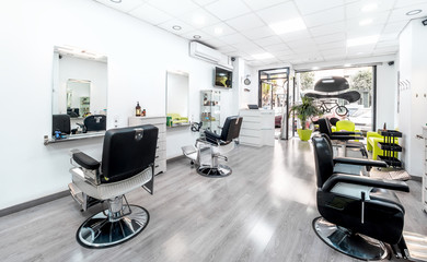 Modern bright hair and beauty salon. Barber salon interior business with black and white luxury decor.