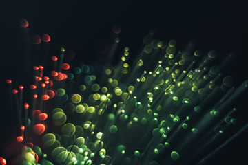 Poster - Beautiful abstract optical fiber green and red  cold bokeh in the darkness background.